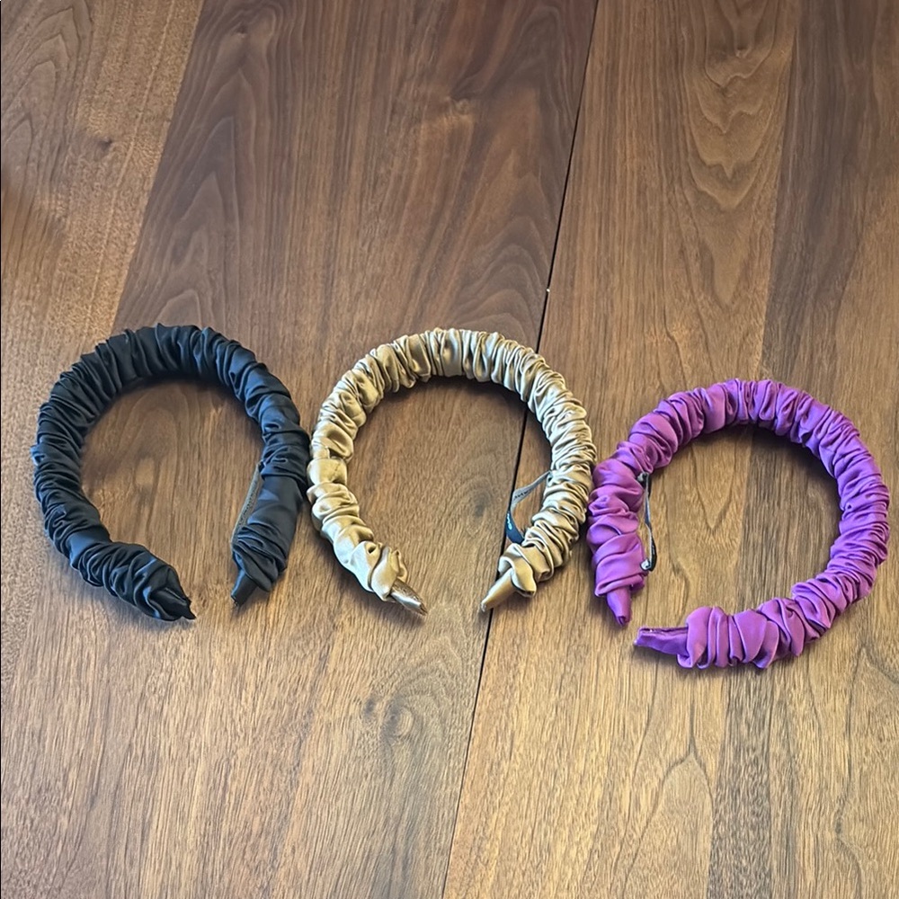 Club Monaco will ruched headbands. Black, gold and fuschia.